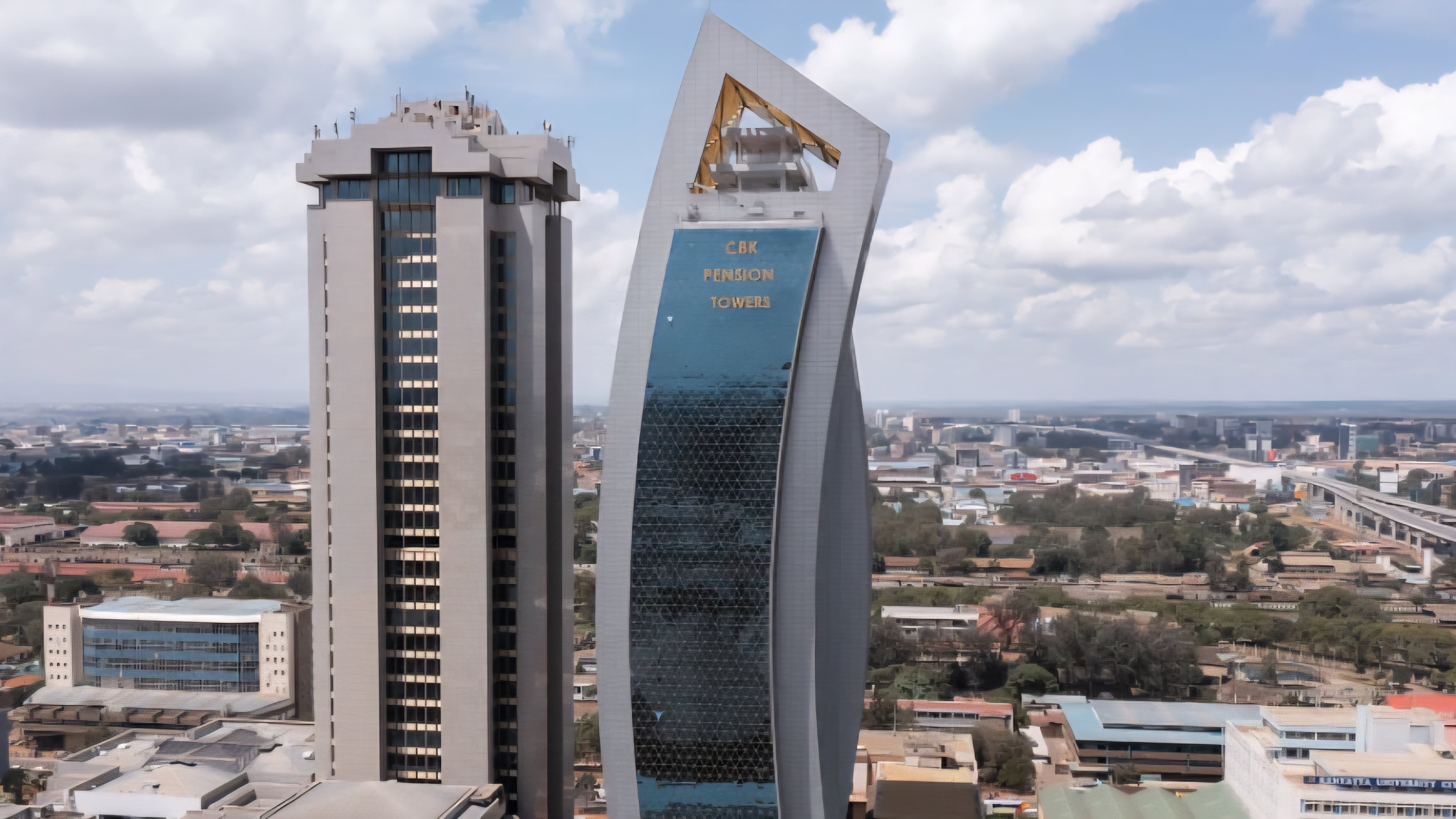 Exterior view of a commercial building in Nairobi housing various financial and cooperative society offices.