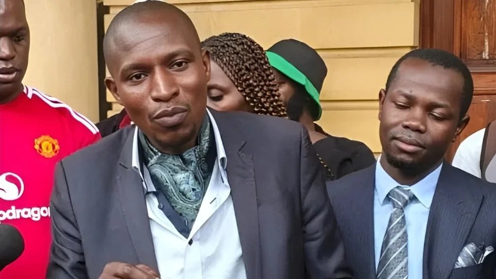 Activist Francis Awino speaking to journalists outside the High Court buildings in Nairobi.