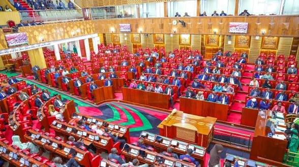Interior view of the Kenyan National Assembly chamber showing members of parliament during a session.