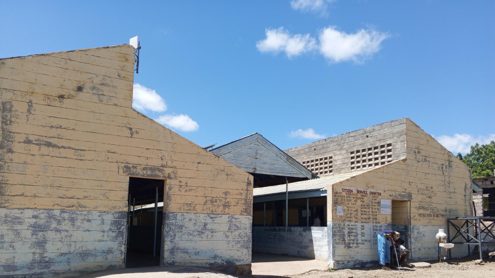 Old single-story stone prison buildings under a blue sky in the historic town of Lokitaung, Turkana County, Kenya.