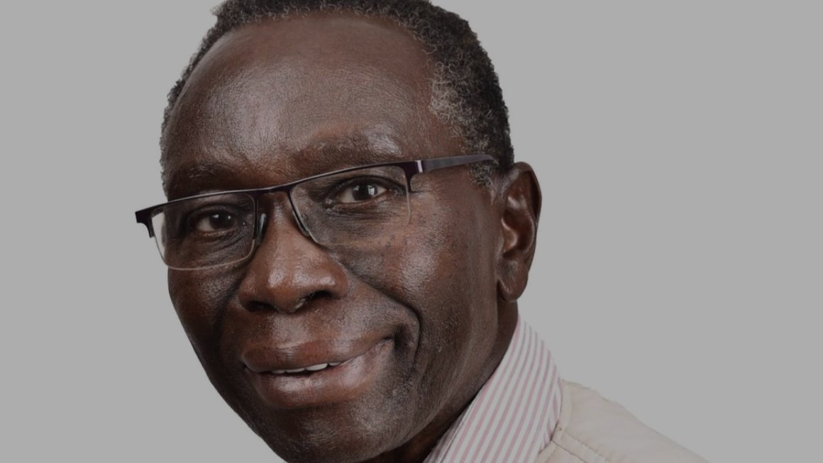 265470.png: Close-up portrait of Kenyan billionaire investor John Kibunga Kimani smiling.