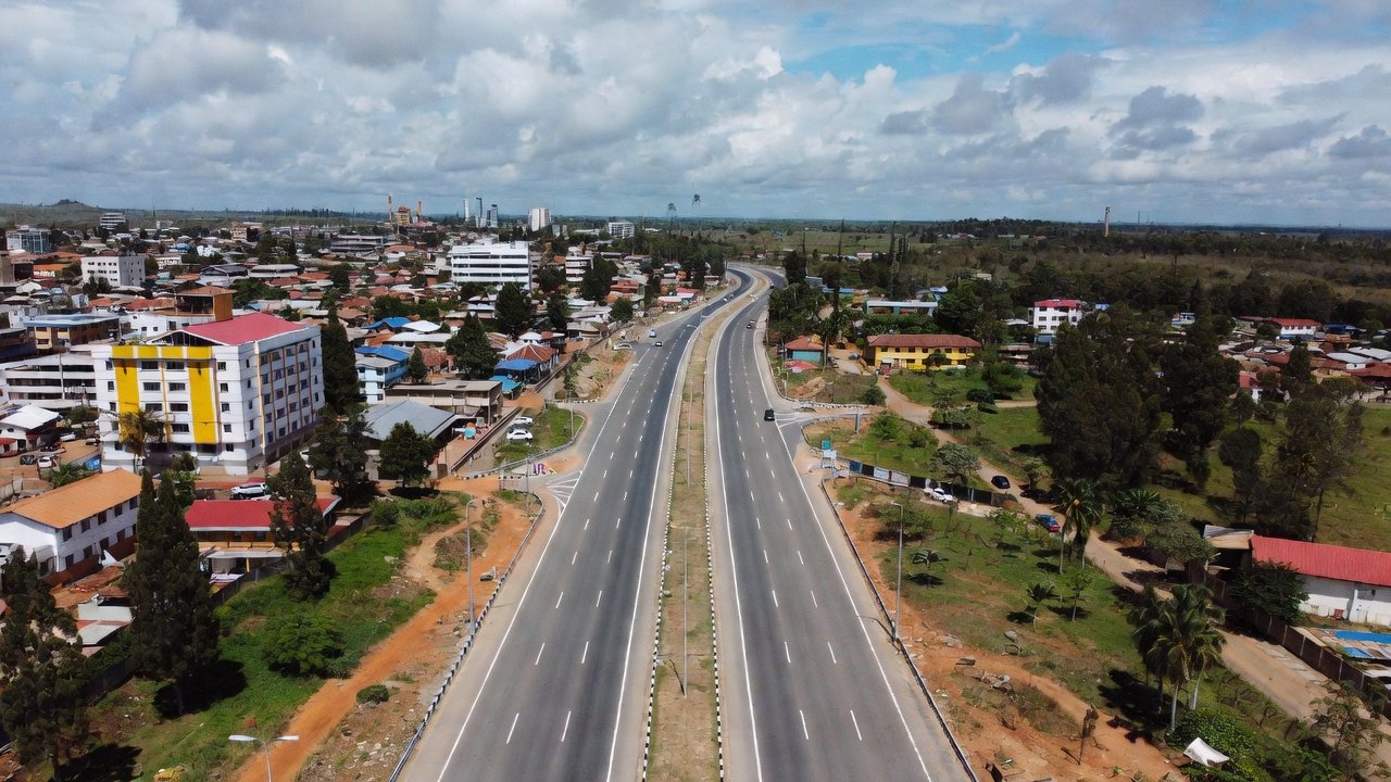 Aerial view of a completed four-lane dual carriageway on the existing Mombasa Road alignment near Athi River, Kenya.