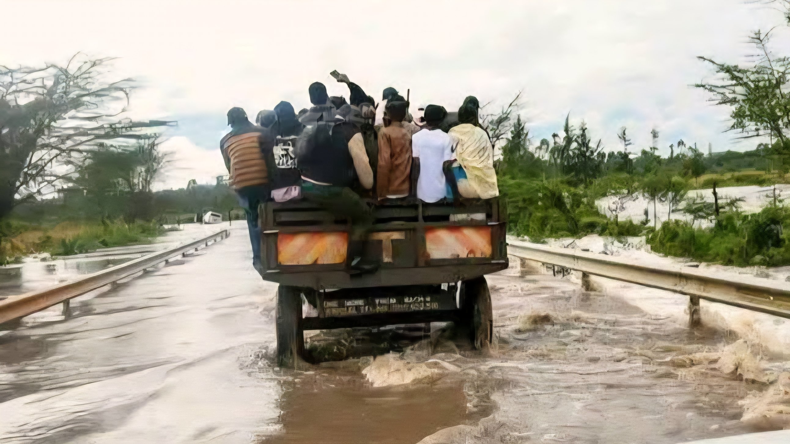 Brown floodwater from the Sosiani River submerging a residential compound and garden plants in Elgon View, Eldoret
