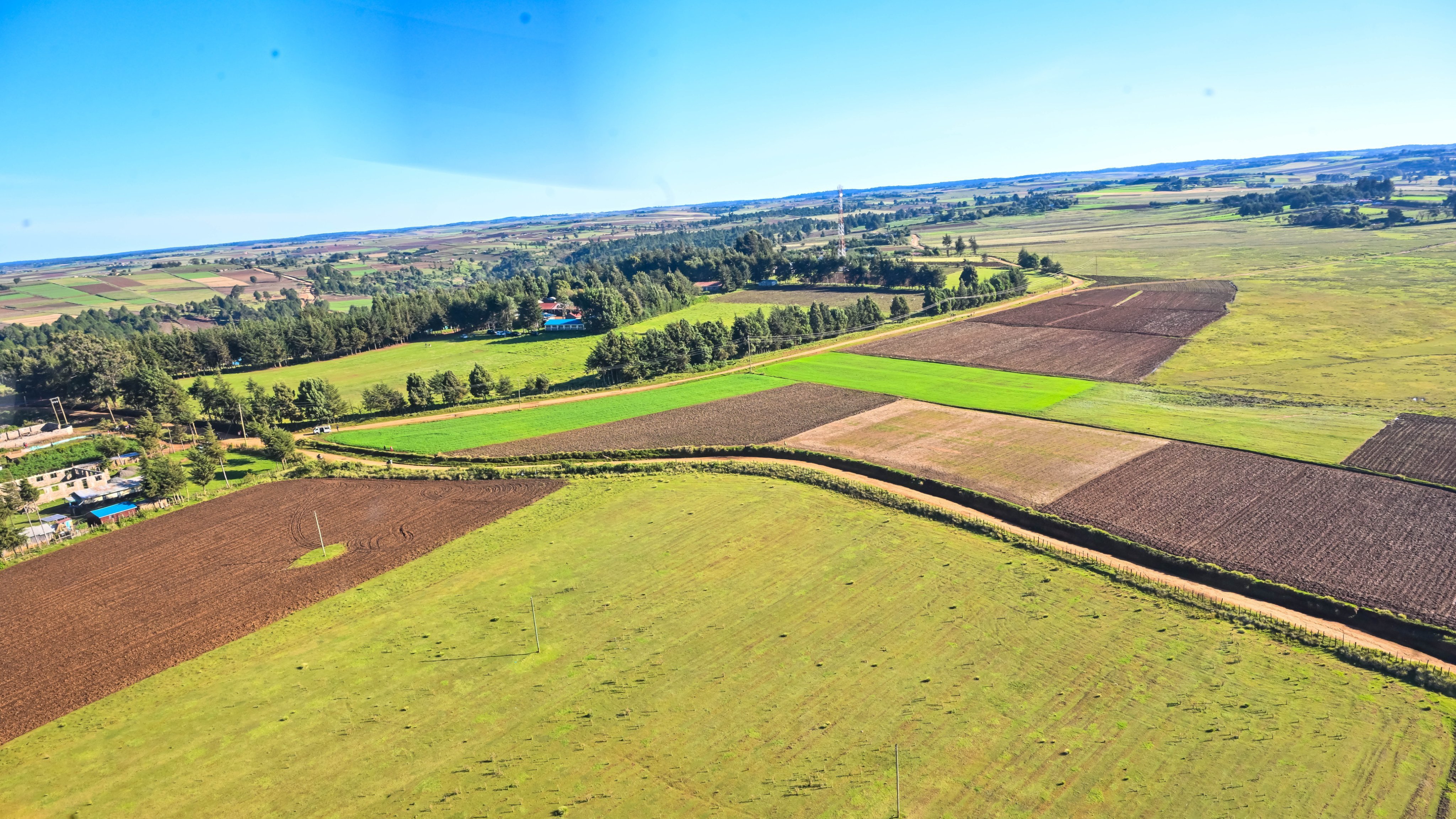 Aerial view of agricultural land and rural road alignment in Narok County, Kenya.