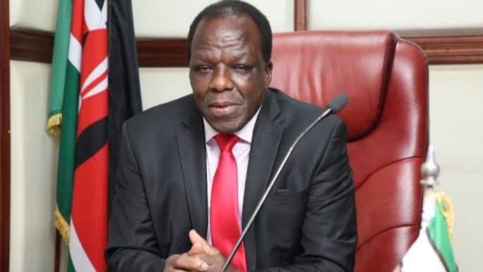 Cabinet Secretary Wycliffe Oparanya speaking at a podium during a public event in Kenya.