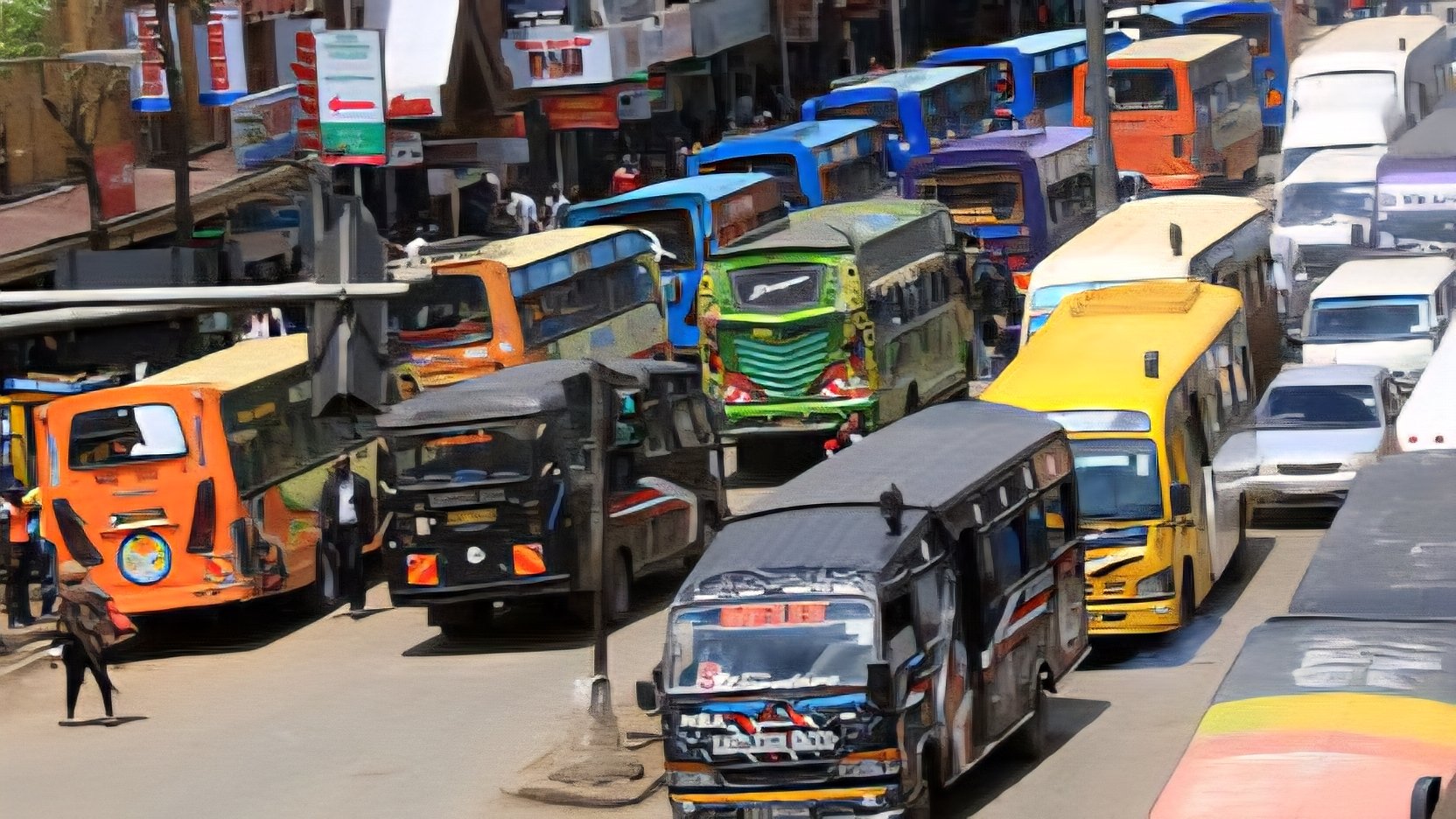 A crowded street in Nairobi filled with colorful matatus featuring various graffiti designs and artistic decorations during peak traffic hours.