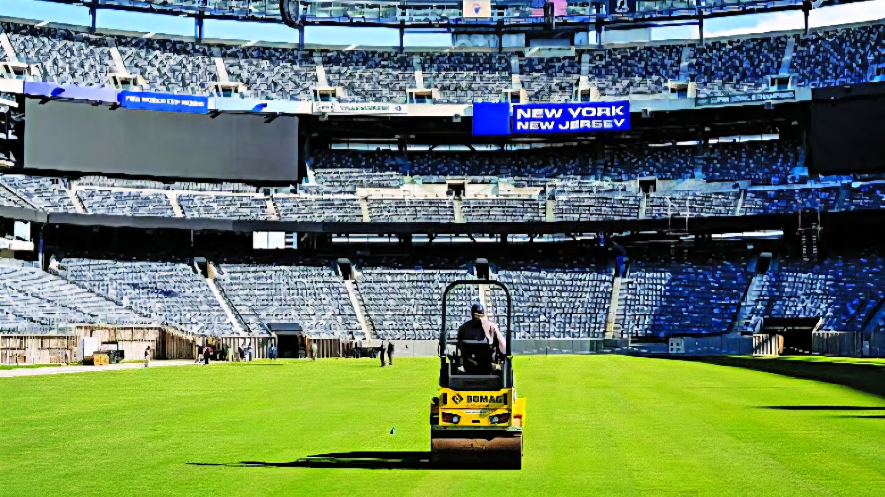 Workers installing natural grass pitch sections inside MetLife Stadium in New Jersey ahead of the 2026 FIFA World Cup final scheduled for July 19.