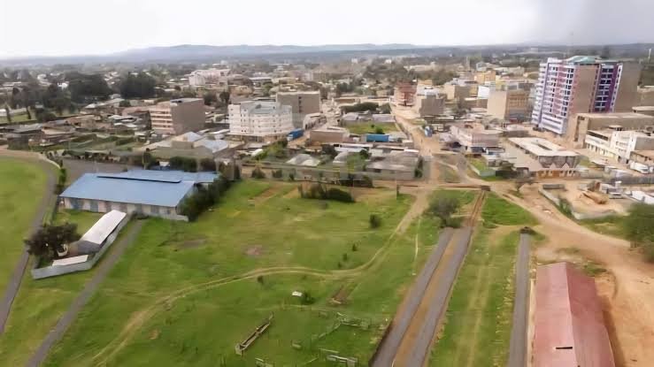 Aerial panoramic view of Nanyuki town showing urban developments, road networks, and green landscapes against the skyline.