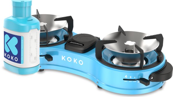 A compact Koko Networks bioethanol cooking stove with a blue fuel canister attached, designed for household use in urban settings.