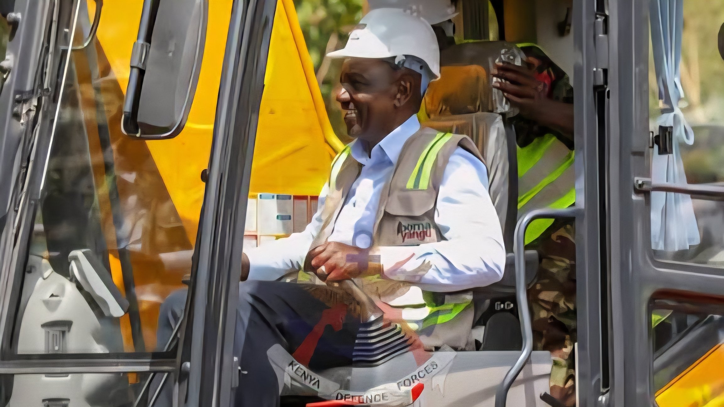 President William Ruto in a high-visibility reflector vest and hat during a site visit.
