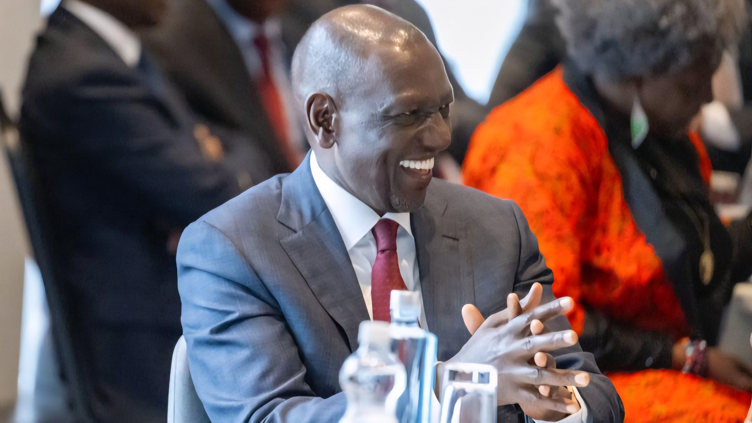 President William Ruto sitting and conversing with delegates during a town hall meeting with the Kenyan diaspora in Helsinki, Finland.