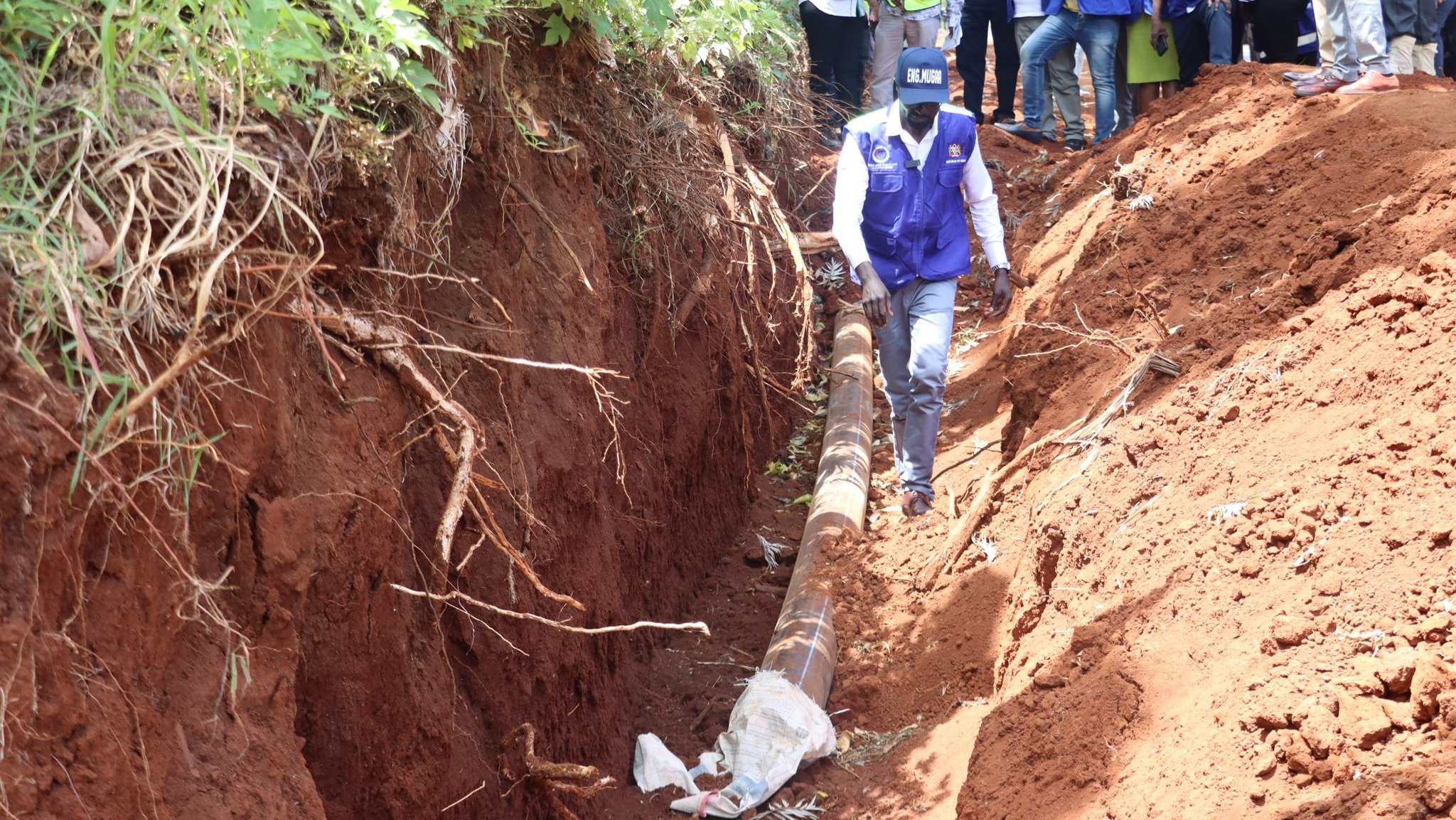 Water CS Eng. Eric Mugaa inspecting the works