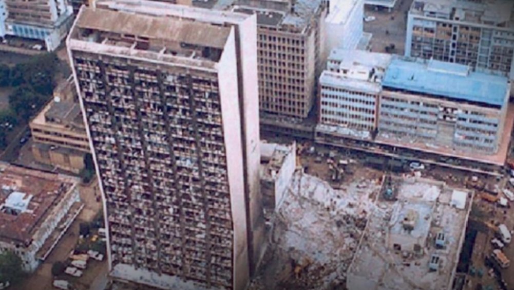 Aerial view of the damaged Cooperative Bank House and the site of the former US Embassy in Nairobi following the 1998 blast.
