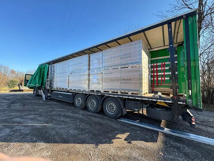 Truck used for collecting and transporting decommissioned solar panels for recycling.