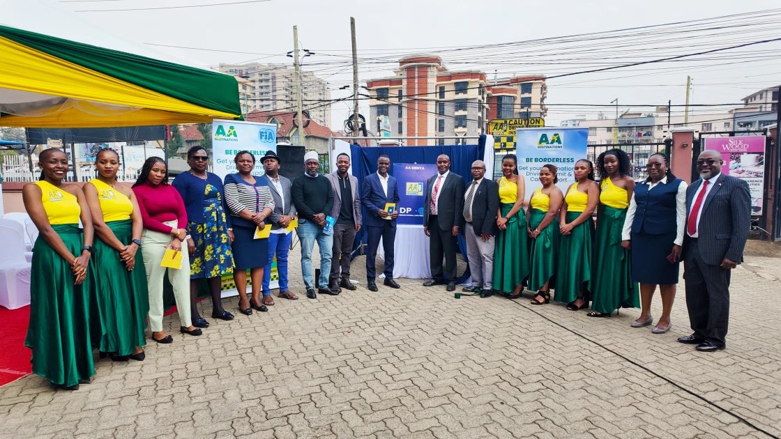 A group of AA Kenya officials and staff posing for a photo during the launch of the upgraded International Driving Permit.