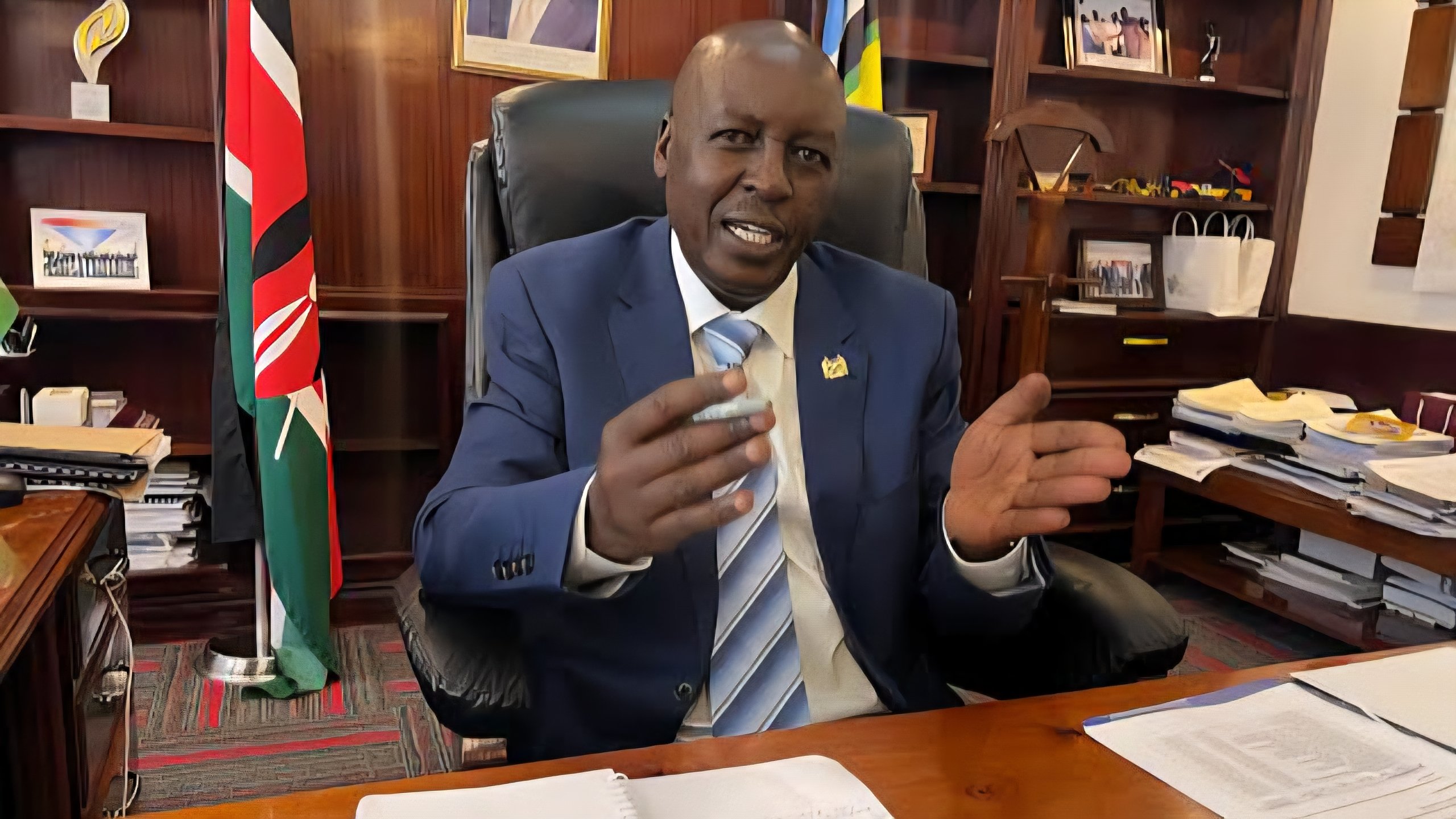 Close-up portrait of PS Joseph Mbugua during an infrastructure briefing in Kenya.