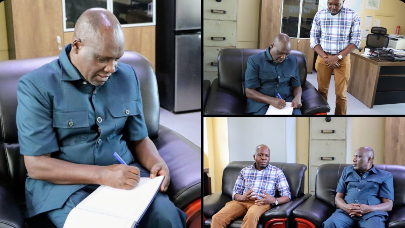 Kenya National Highways Authority Director General Eng. Luka Kimeli signs a visitor logbook during a meeting with Coast Region engineers in Mombasa.