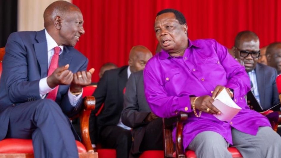 President William Ruto conversing with COTU Secretary General Francis Atwoli at the 61st Labour Day celebrations.