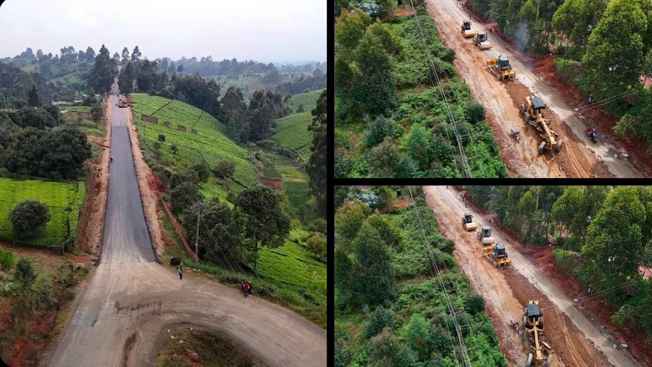 Aerial view of a newly tarmacked road winding through green tea plantations in Nyanduma Ward with construction vehicles parked on a dirt section.
