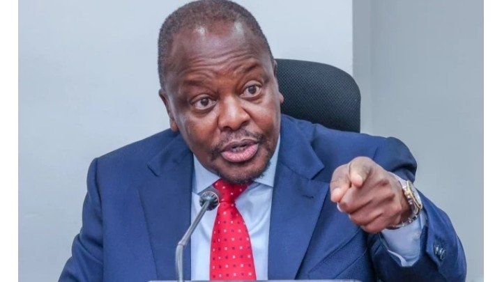 Agriculture Cabinet Secretary Mutahi Kagwe seated in his office discussing strategies to promote investment and support economic growth in Kenya