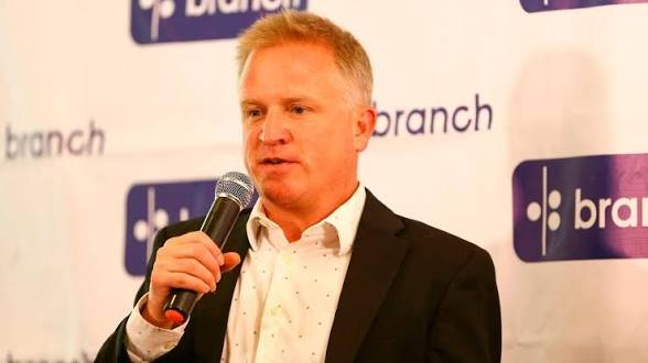 Matt Flannery, CEO of Branch International, speaking at a corporate event with the company logo visible in the background.