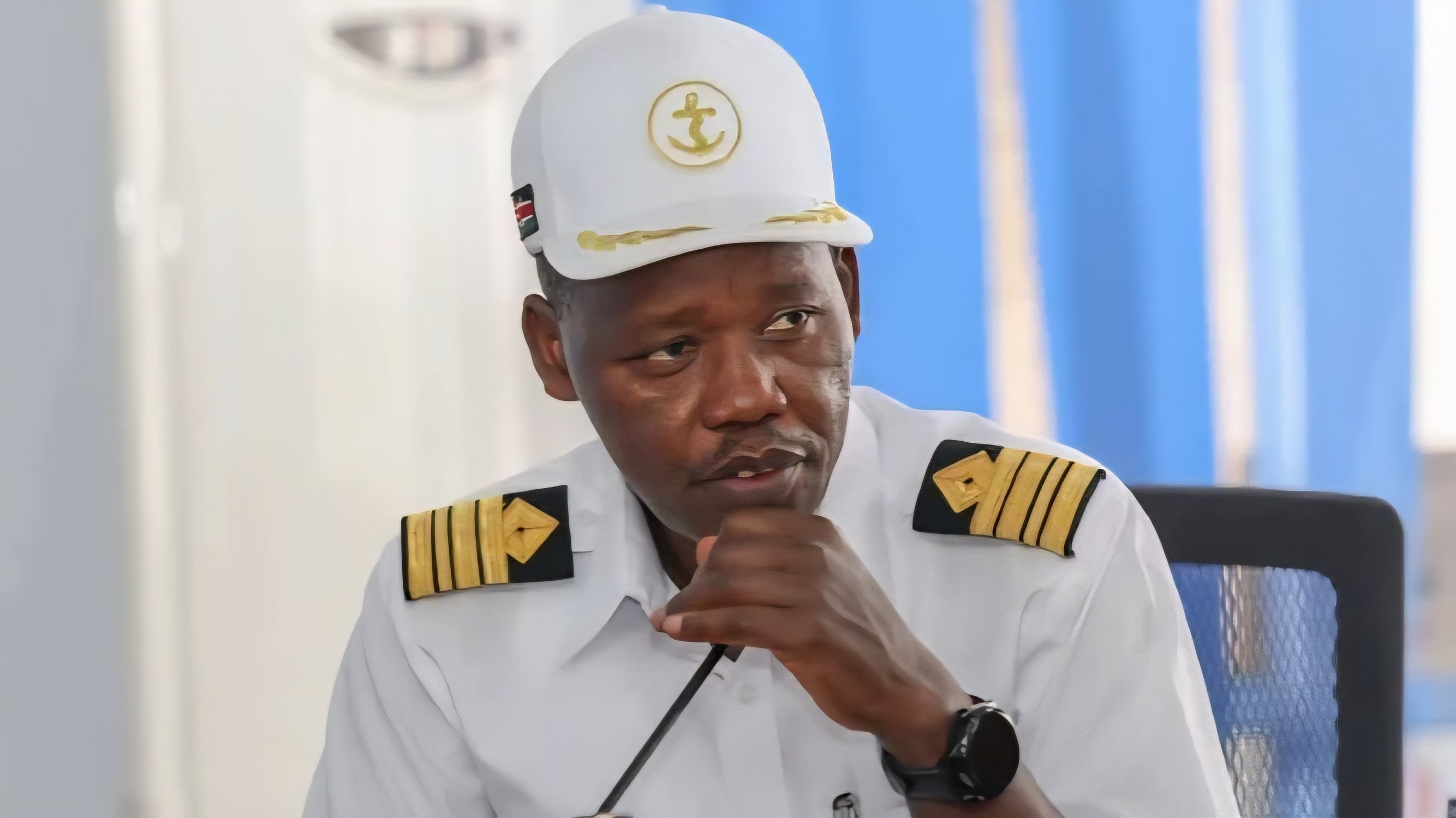 A high-ranking Kenya Ports Authority official in a white maritime uniform speaking during a press briefing or event.