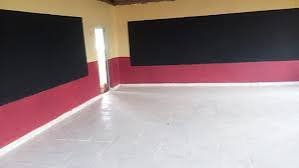 A recently renovated classroom in Kiharu featuring new ceramic floor tiling and freshly painted walls.