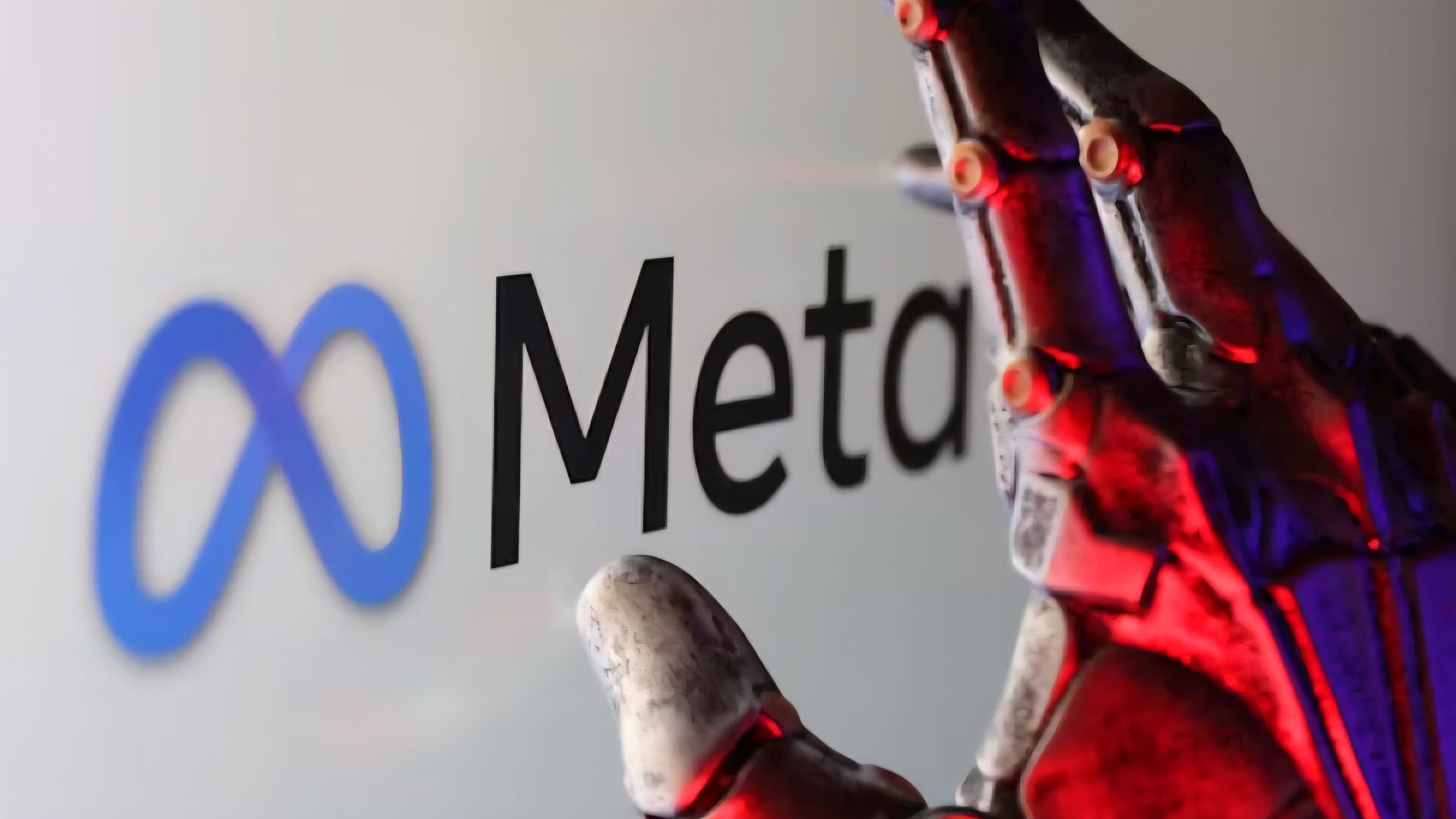 A digital display showing the Meta logo alongside a red robotic hand, symbolizing the intersection of social media engineering and technology.