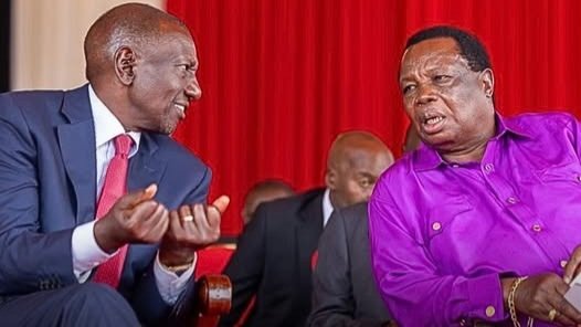 President William Ruto and COTU General Secretary Francis Atwoli speaking at an event.