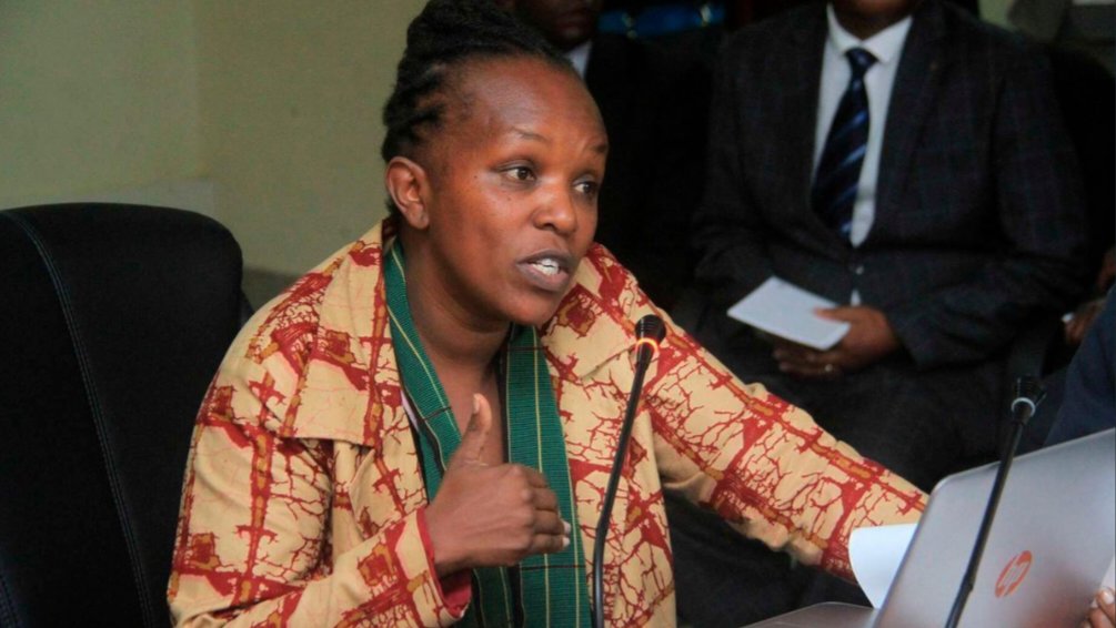 Witness Protection Agency Chief Executive Officer Jedidah Waruhiu speaking into a microphone during an official press briefing.