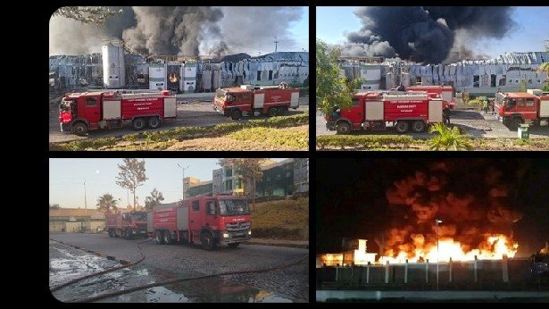 Firefighters battling a large fire at an oil factory along Mombasa Road in Kenya, with heavy black smoke visible in the background.
