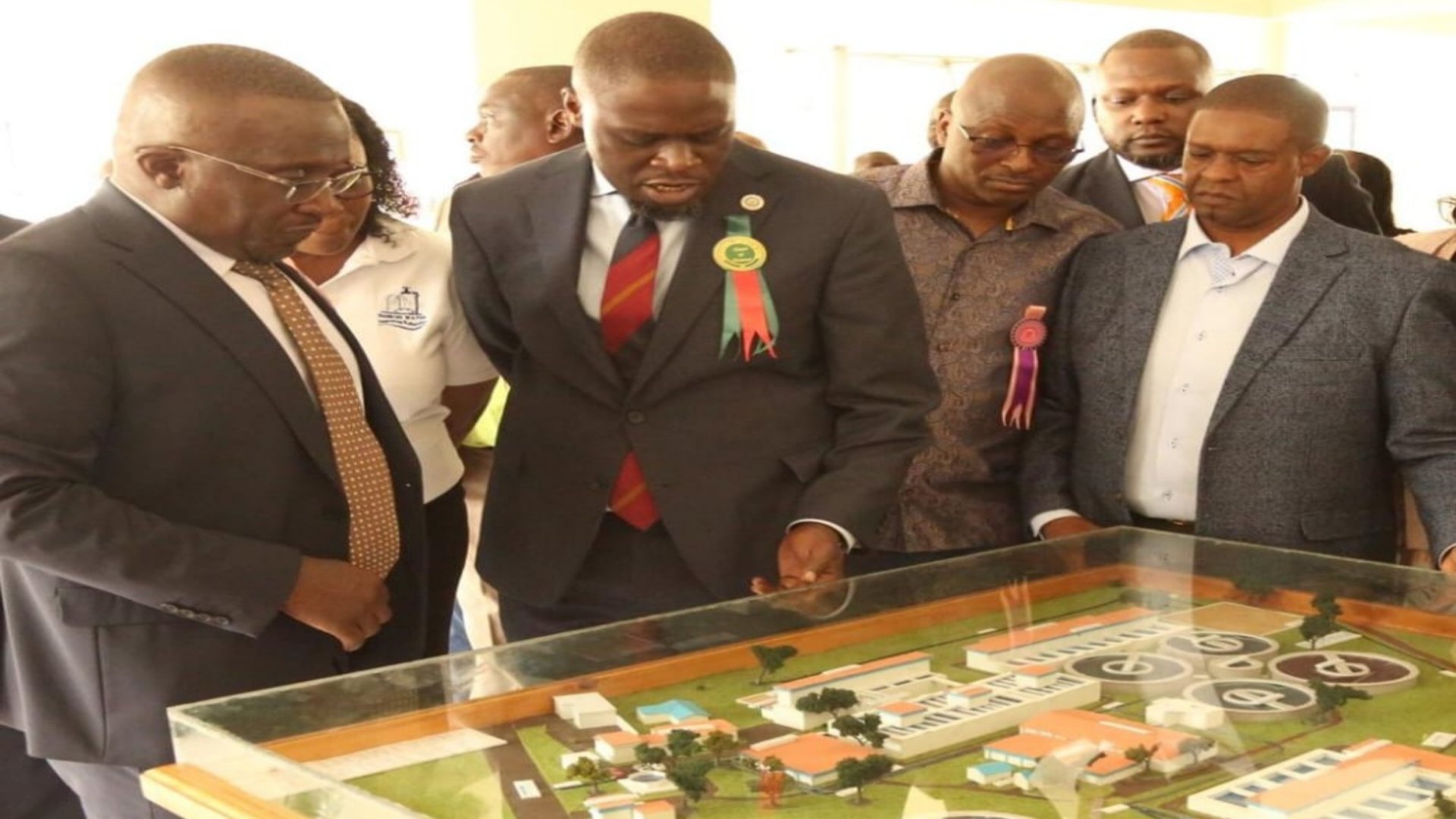 Nairobi City Water and Sewerage Company (NCWSC) official monitoring the GIS-based asset management platform showing the city's water and sewer infrastructure network.