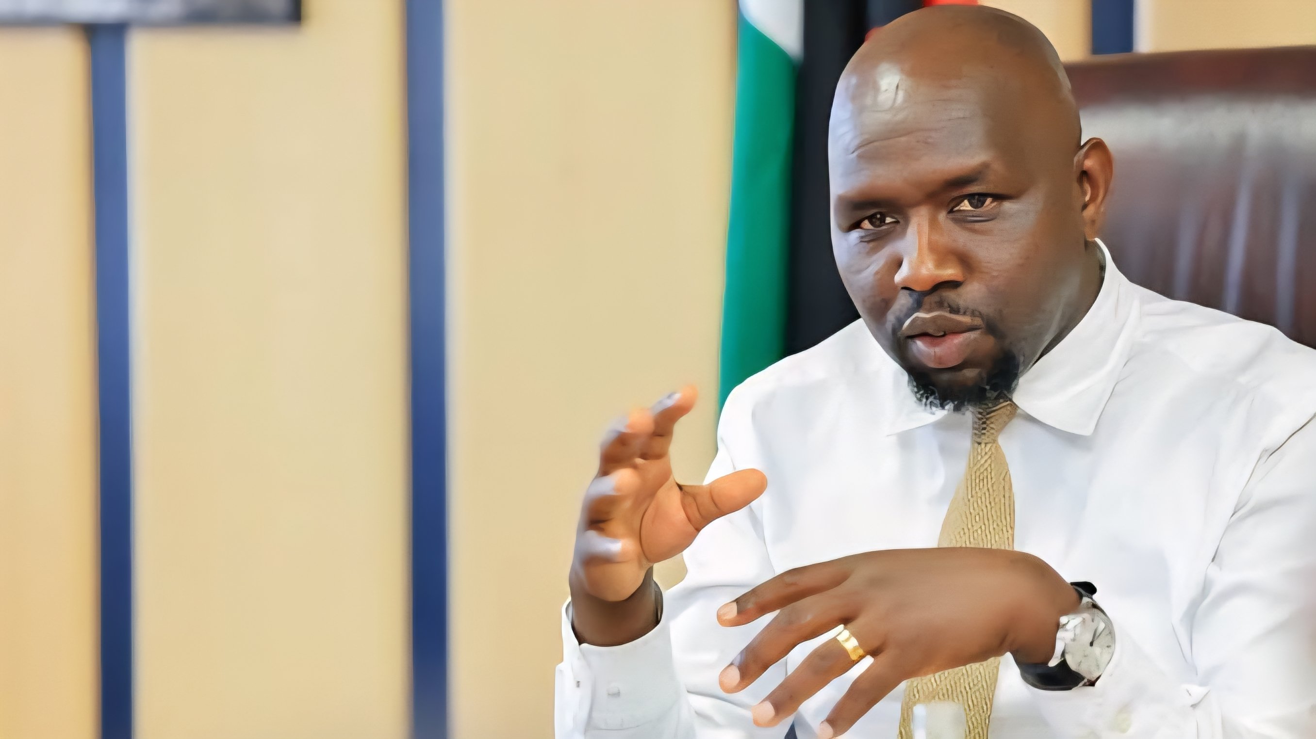 Interior Cabinet Secretary Kipchumba Murkomen speaking at a meeting in an office setting
