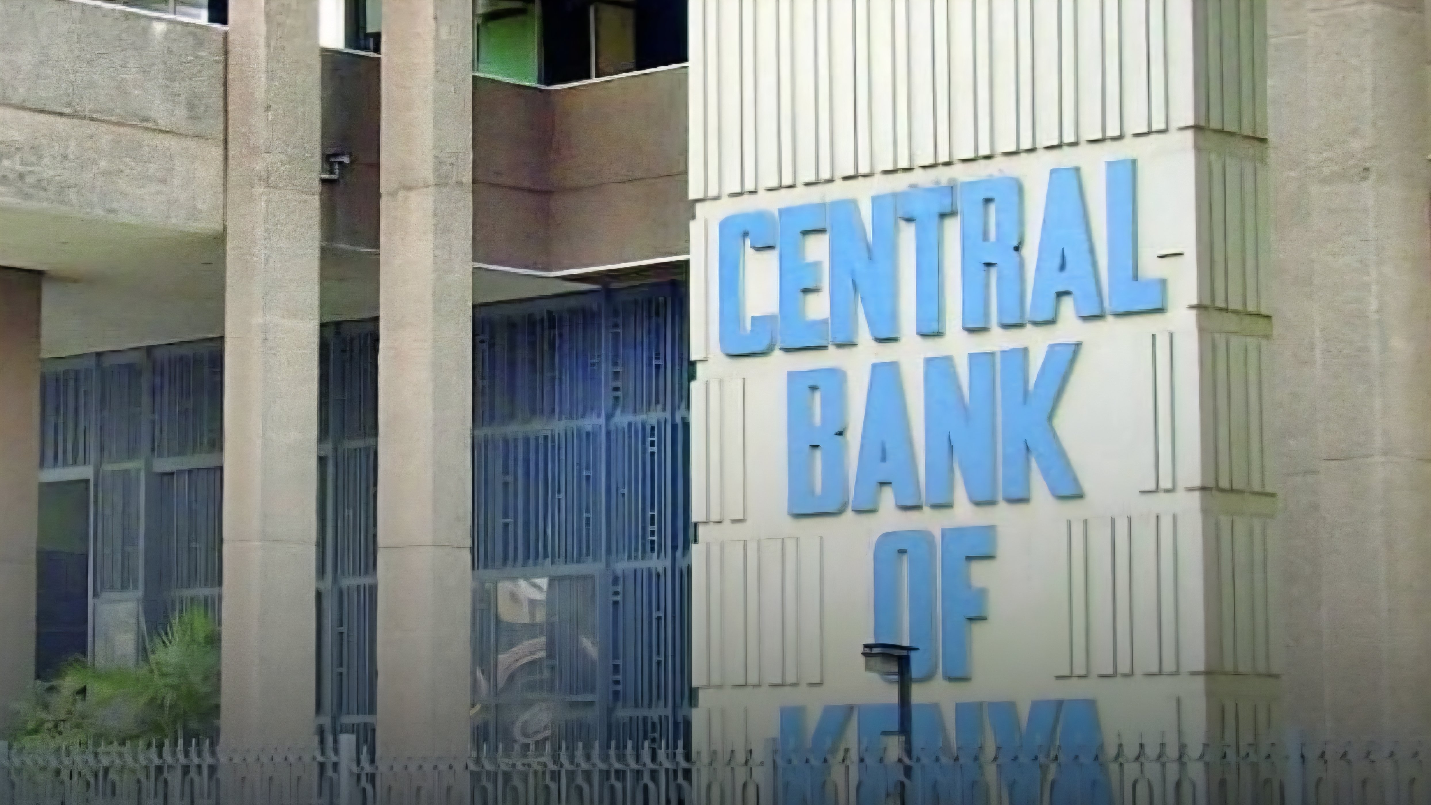 A view of the Central Bank of Kenya building in Nairobi, showing the official signage and architectural facade under daylight.