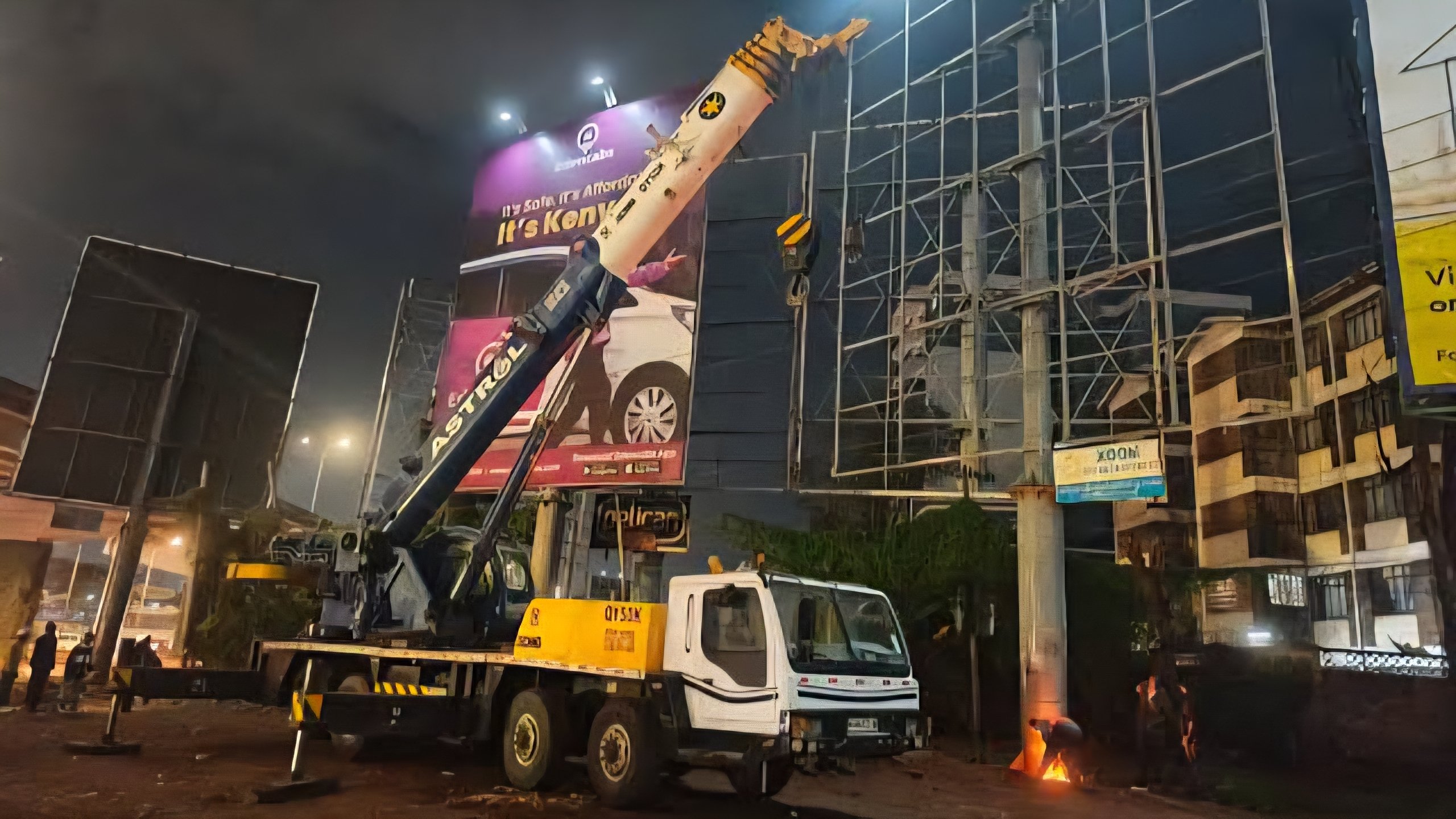 Crane mounting a billboard steel structure