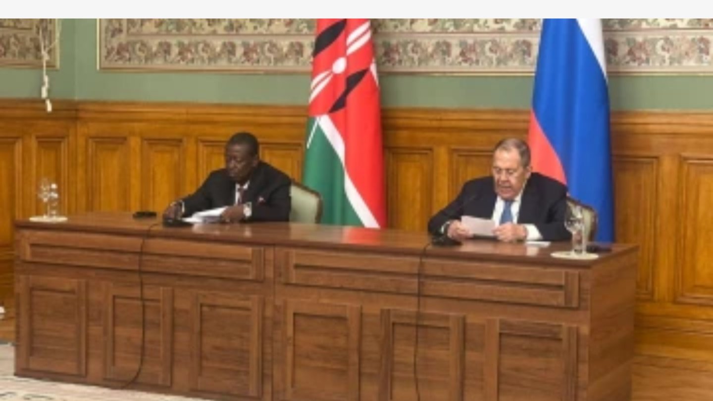 Kenyan Foreign Affairs Minister Musalia Mudavadi and Russian Foreign Minister Sergey Lavrov seated at a large wooden desk during a formal meeting in Moscow.