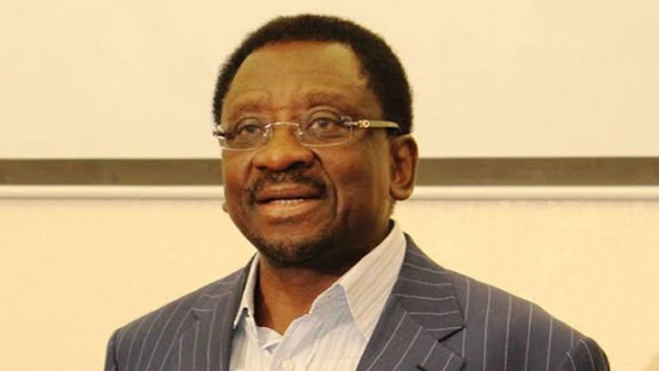 Governor James Orengo of Siaya County looking forward during a public event with other officials standing in the background.