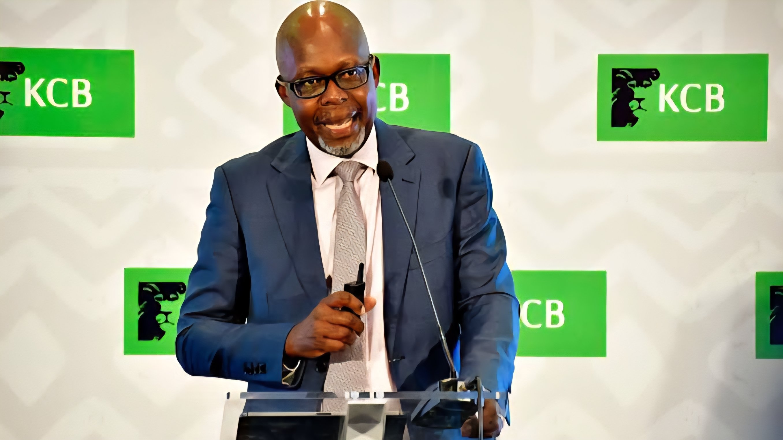 KCB Group Finance Director Lawrence Kimathi speaking at a podium during the 2025 financial results announcement in Nairobi.
