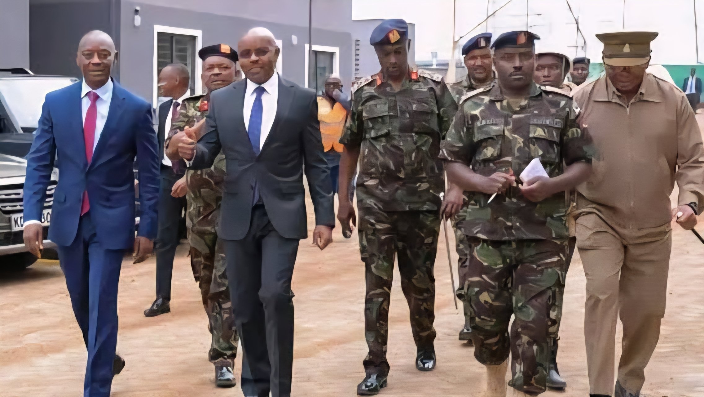Image 290248.jpg shows Ministry of Defence Principal Secretary Dr. Patrick Mariru and military officials reviewing a project model at the Kahawa Garrison construction site.