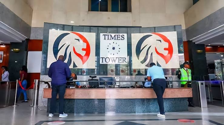 Close-up of the Kenya Revenue Authority logo on a glass building entrance in Nairobi.