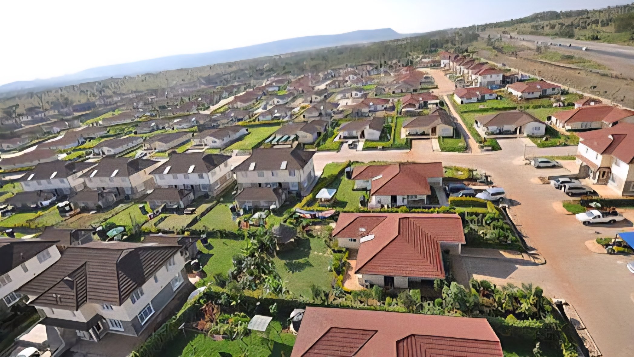 Aerial view of the Green Park Estate residential development in Athi River featuring rows of uniform maisonettes and villas.