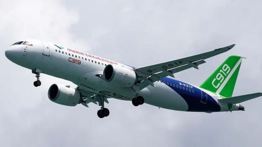 COMAC C919 narrowbody passenger jet on static display at Singapore Airshow 2026 exhibition grounds.