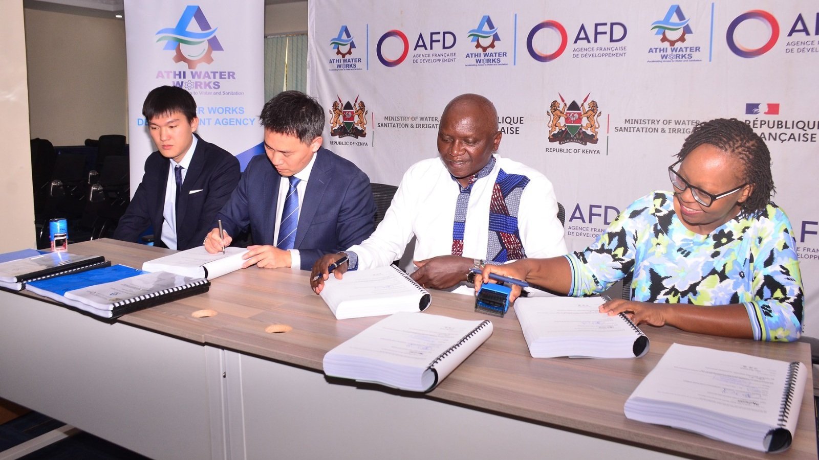 Officials from Athi Water Works Development Agency and representatives from Zhongmei Engineering Group and Hunan Construction Investment sign a contract at a boardroom table for the Sh3 billion Nairobi water and sewerage upgrade project.