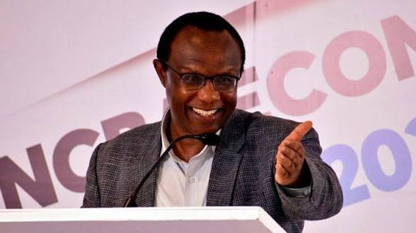 David Ndii speaking at a podium during a Kenya Times event with a graphic detailing infrastructure fund leverage figures.