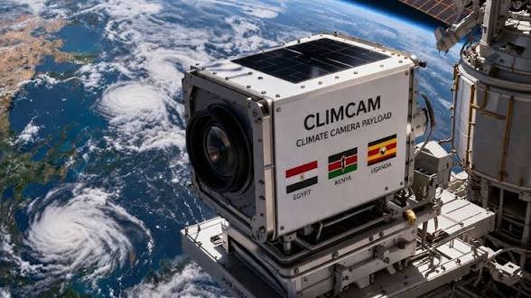 Side view of the white ClimCam climate camera payload showing the flags of Egypt, Kenya, and Uganda against the backdrop of Earth from space.