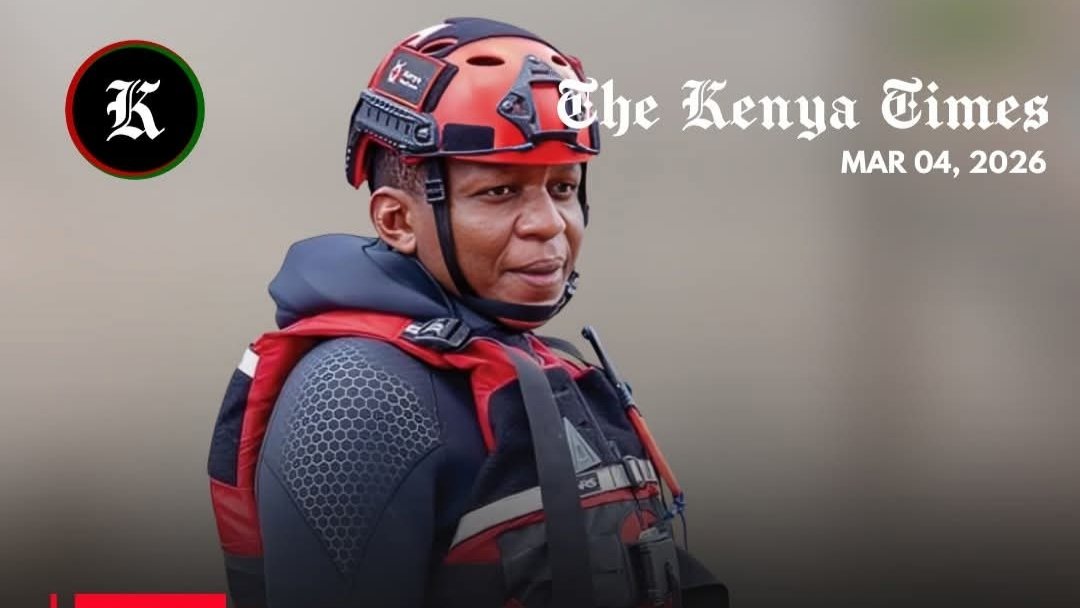 Samuel Wanyonyi Wangila wearing a red rescue helmet and life vest during a field operation