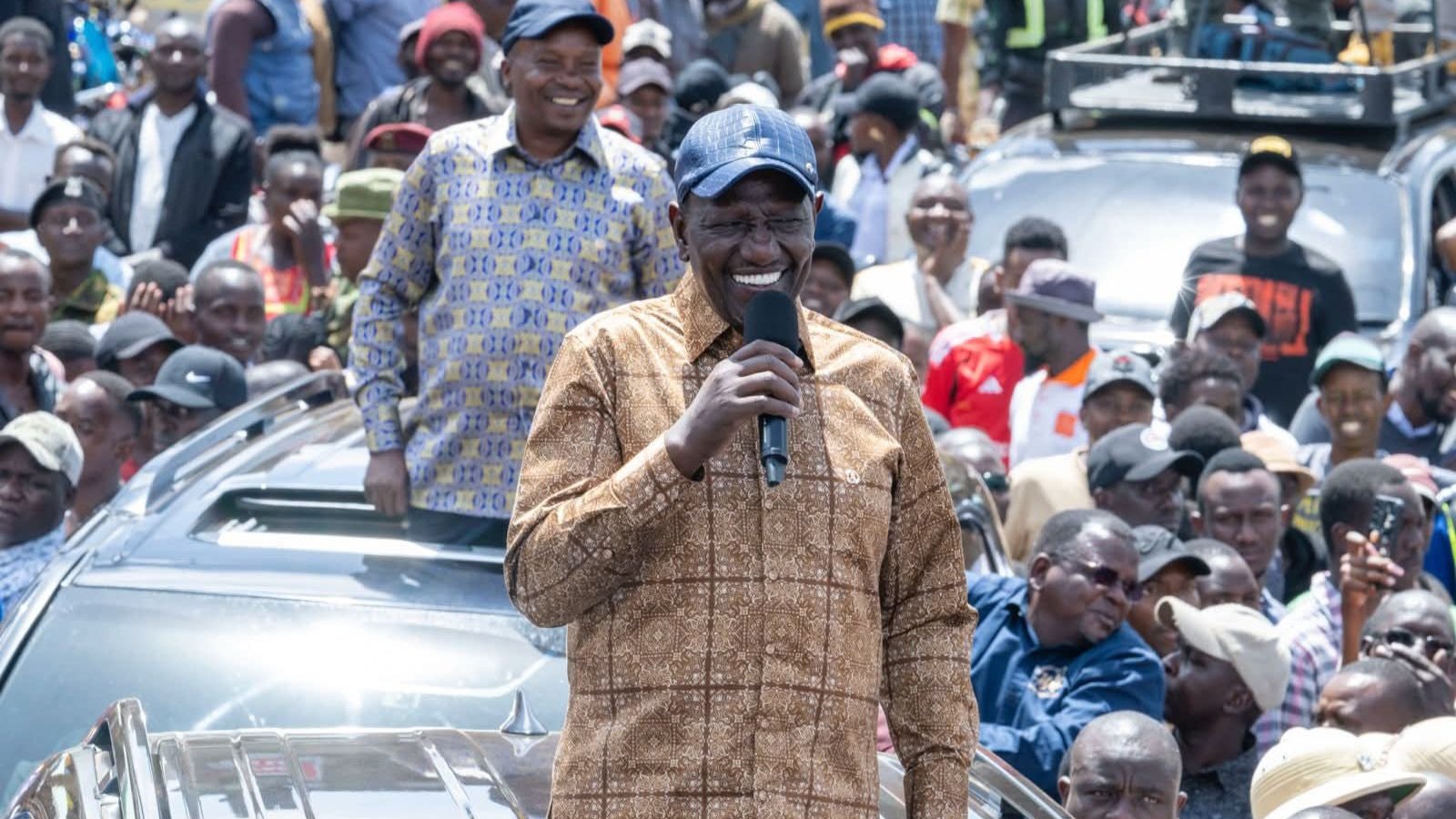 President William Ruto addresses a large, cheering crowd in Makutano town