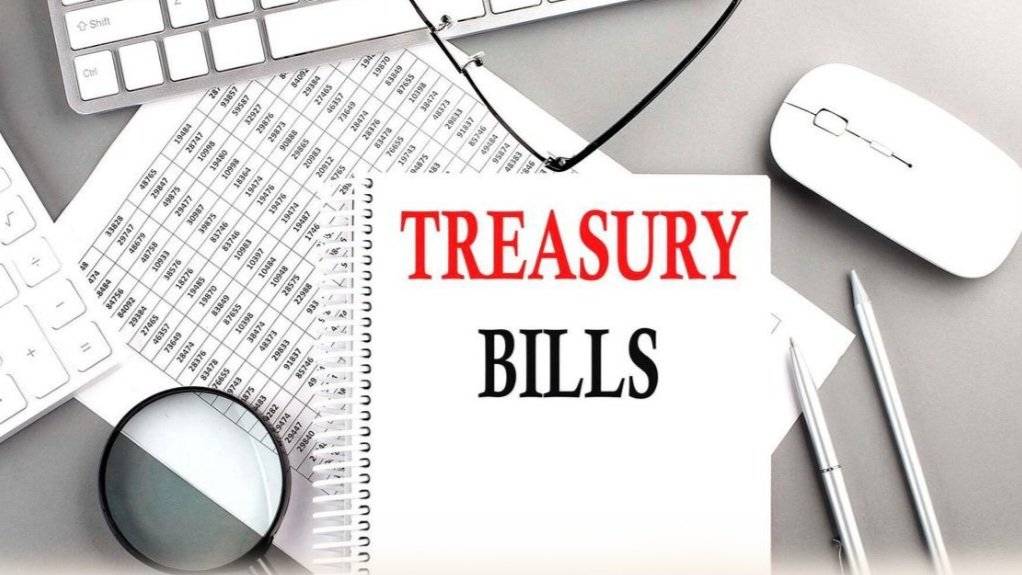 A computer keyboard, mouse, and printed document displaying the text Treasury Bills on an office desk.