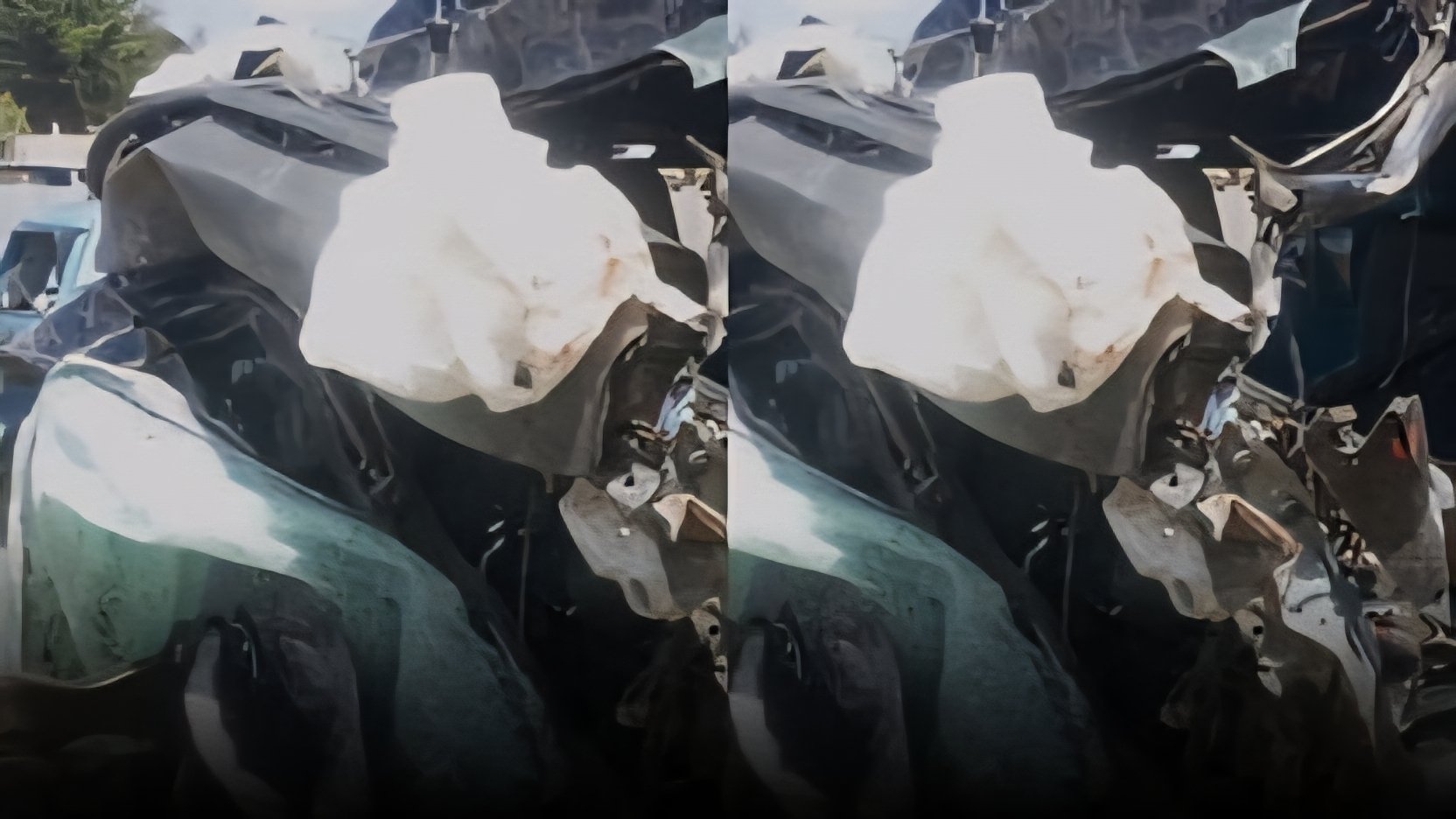 View of a narrow section of the Nakuru-Eldoret highway at Mau Summit showing heavy transit trucks and passenger vehicles sharing a single-carriageway.