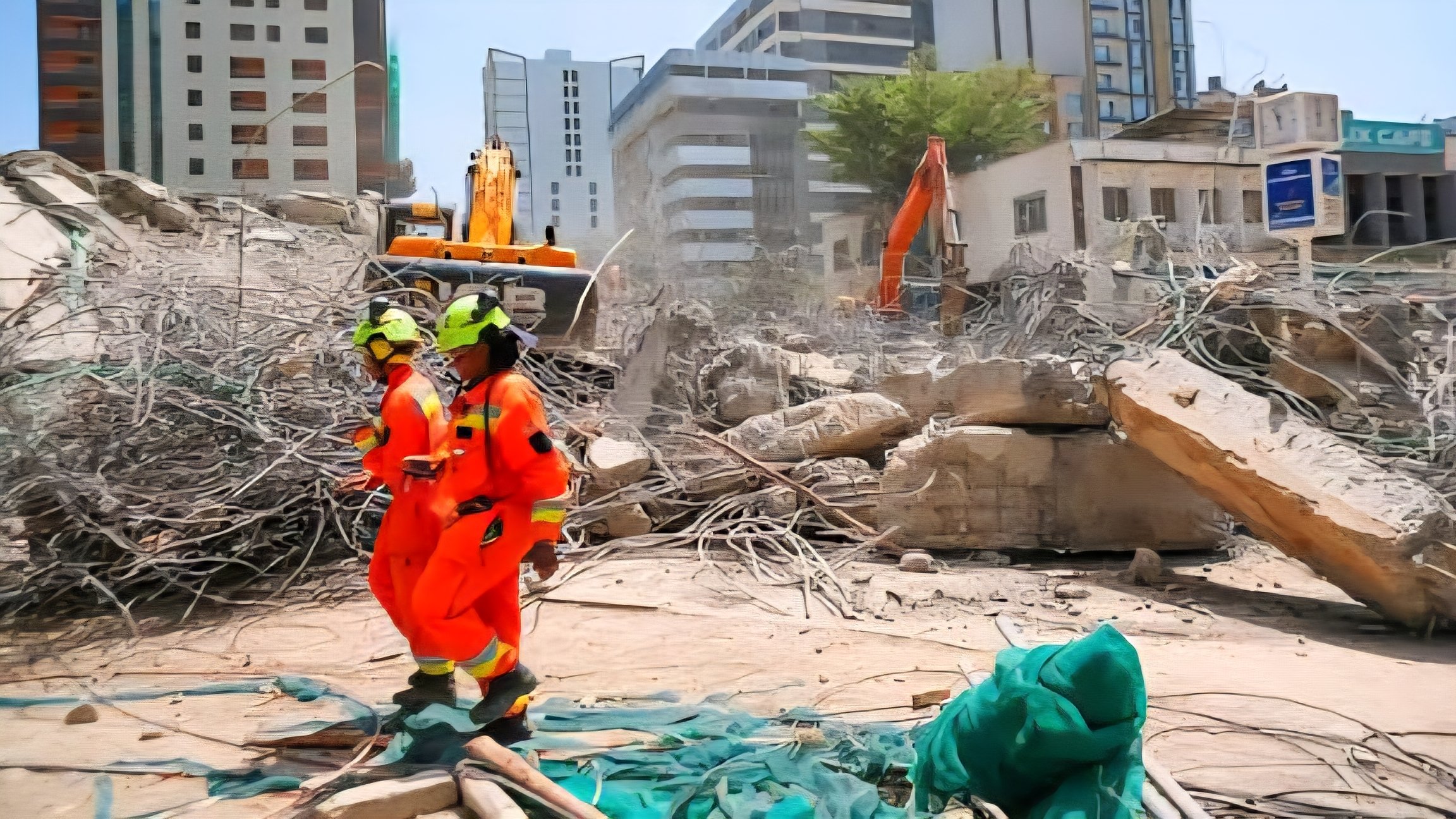 A view of the collapsed eight-story residential building in South C showing twisted metal reinforcements and broken concrete slabs at the site.